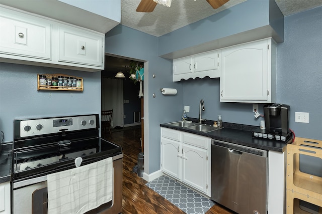 kitchen featuring sink, ceiling fan, stainless steel appliances, white cabinets, and dark hardwood / wood-style flooring