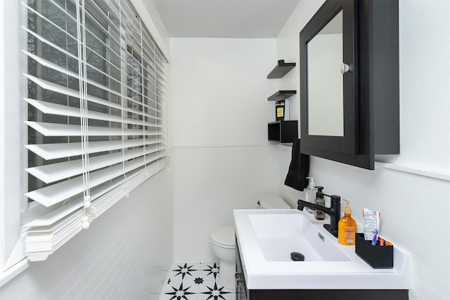 bathroom with vanity and toilet