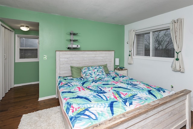 bedroom featuring dark wood-type flooring