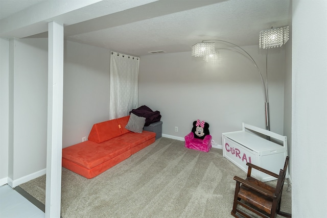 interior space with carpet floors and a textured ceiling