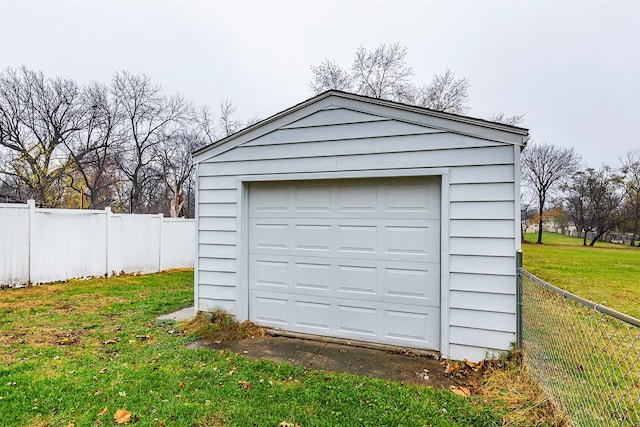 garage featuring a lawn