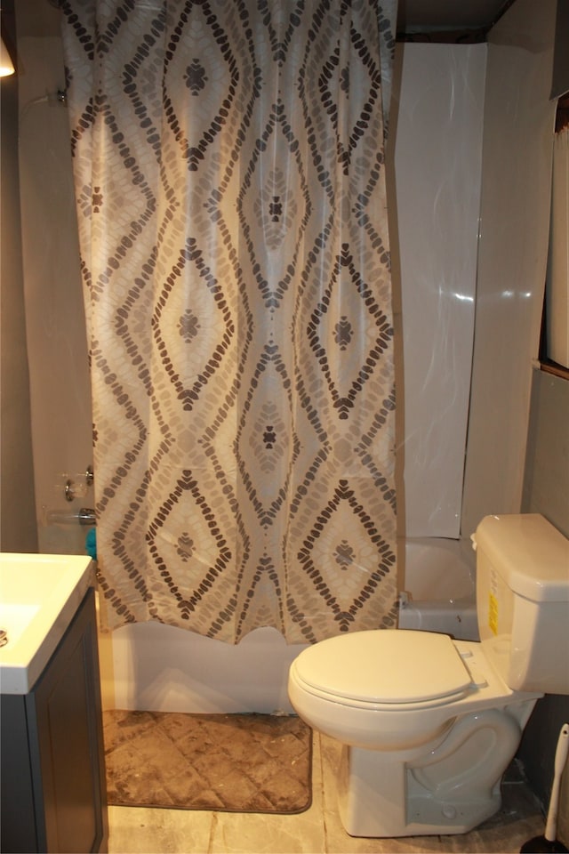 bathroom with tile patterned flooring, vanity, and toilet