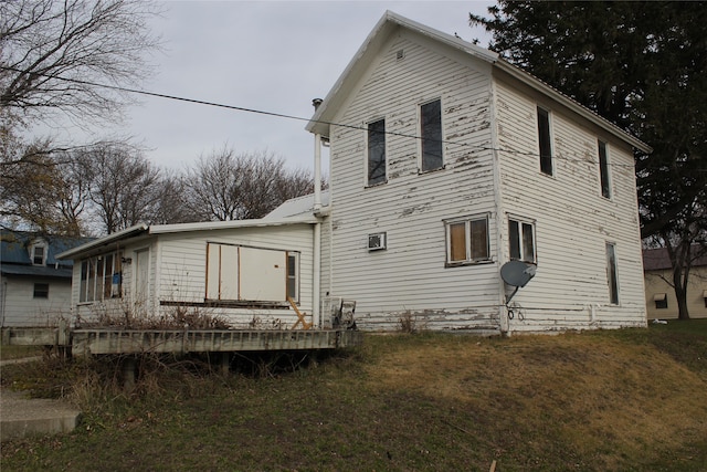 rear view of house with a lawn