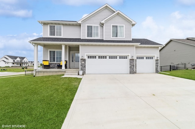 view of front of home featuring a front yard and a garage