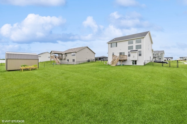 rear view of house featuring a lawn