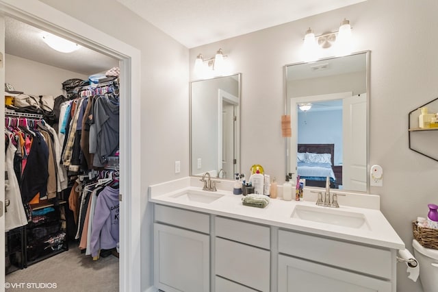 bathroom with a textured ceiling and vanity