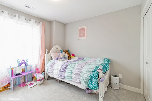 carpeted bedroom featuring a closet