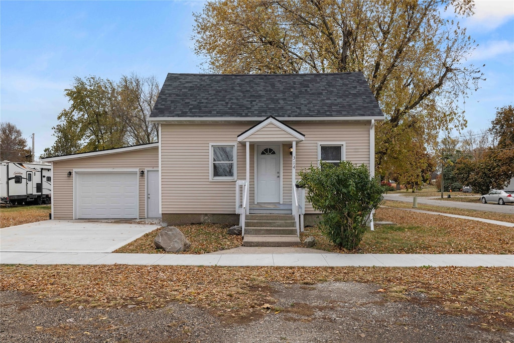 bungalow-style home with a garage