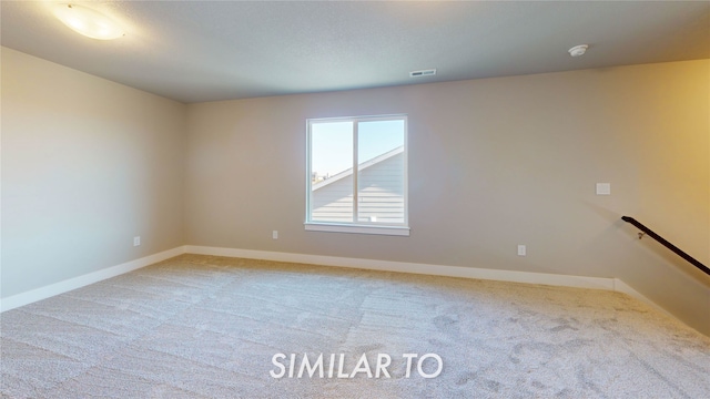 empty room featuring carpet flooring