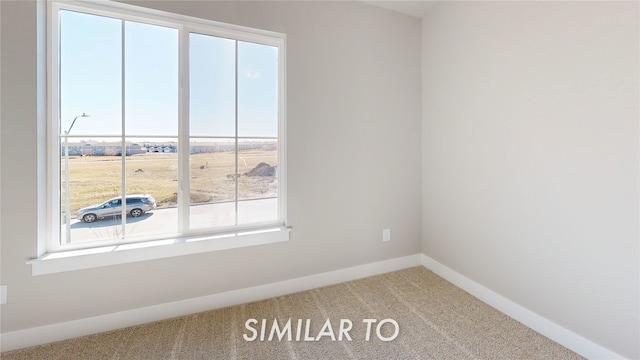 empty room featuring carpet flooring