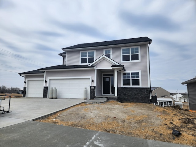 view of front of home with a garage