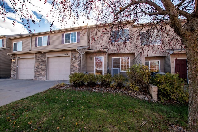 townhome / multi-family property featuring a garage