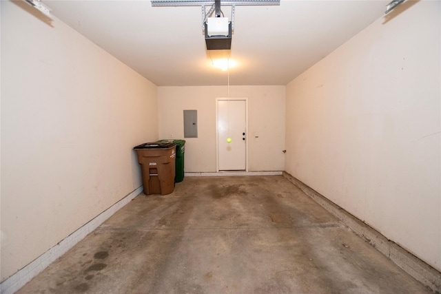 garage with electric panel and a garage door opener