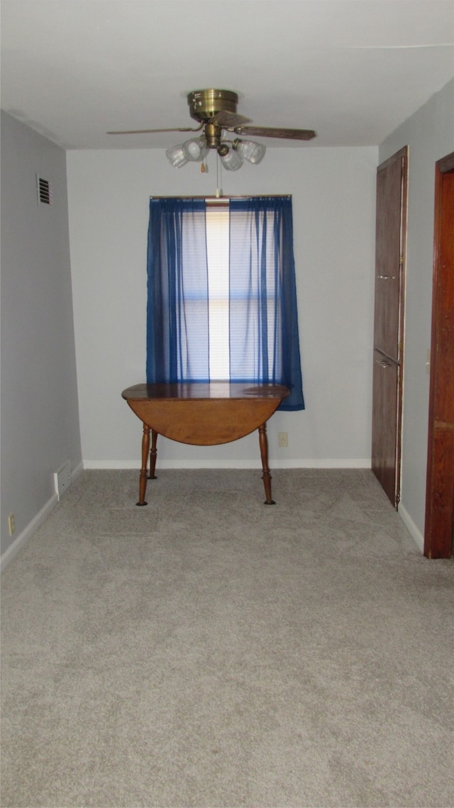 interior space featuring ceiling fan