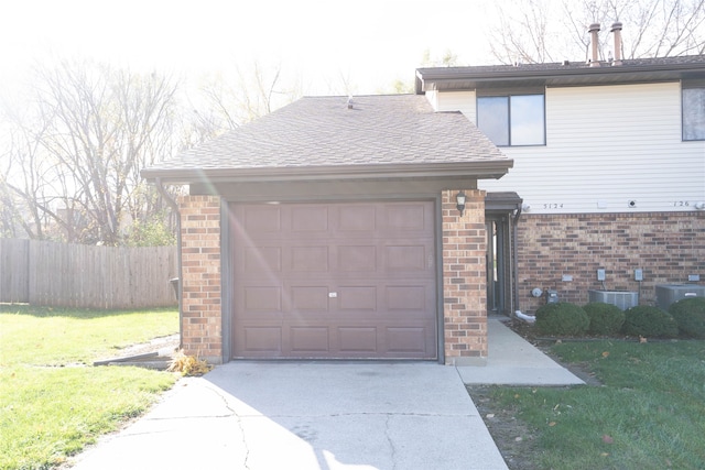 garage featuring a lawn