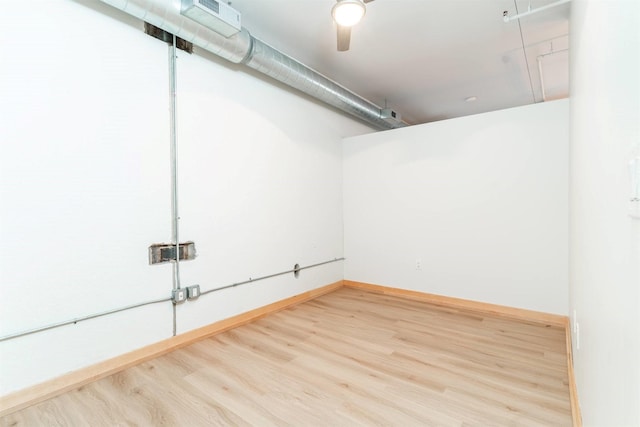 basement featuring hardwood / wood-style floors