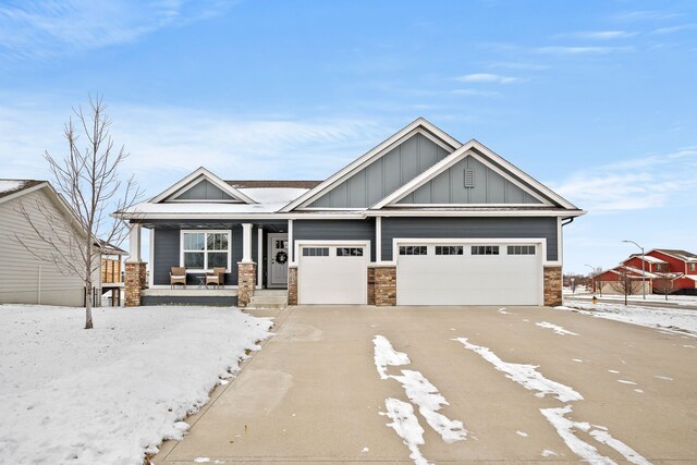 craftsman-style home featuring a porch and a garage