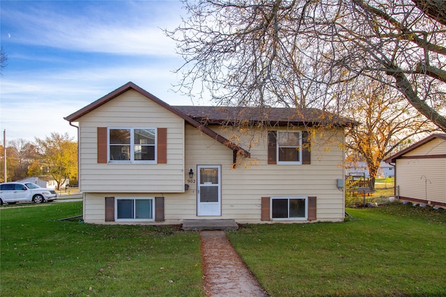 bi-level home with a front yard