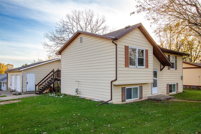 view of property exterior featuring a lawn