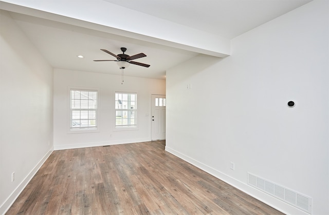 unfurnished room featuring hardwood / wood-style flooring and ceiling fan