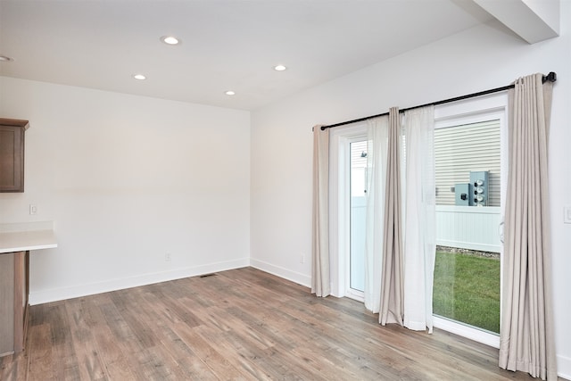 unfurnished room featuring light hardwood / wood-style flooring