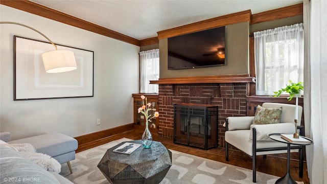 living room with a fireplace, hardwood / wood-style floors, plenty of natural light, and ornamental molding