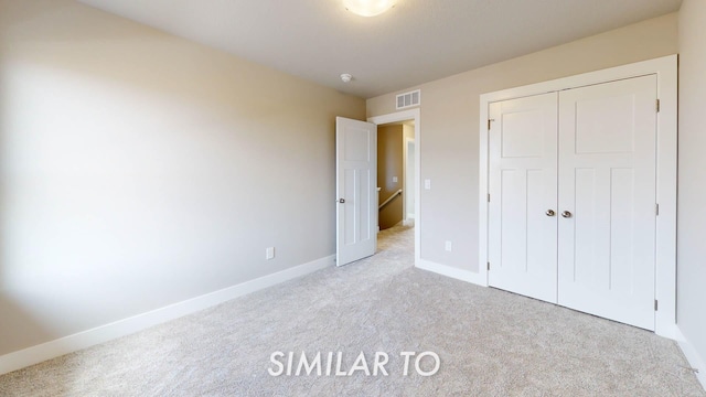 16409 Deerview Dr, Urbandale, IA 50323 - unfurnished bedroom with carpet floors, baseboards, a closet, and visible vents