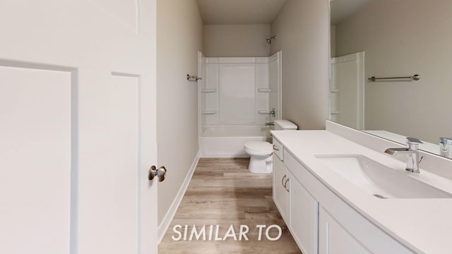 16409 Deerview Dr, Urbandale, IA 50323 - bathroom featuring vanity, shower / bathtub combination, wood finished floors, toilet, and baseboards