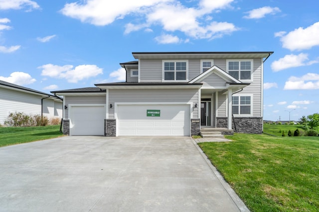 16409 Deerview Dr, Urbandale, IA 50323 - view of front of house featuring an attached garage, concrete driveway, a front lawn, and stone siding