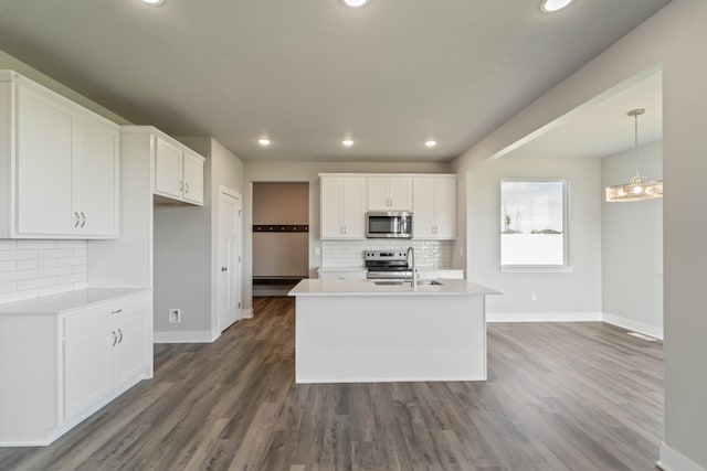 16409 Deerview Dr, Urbandale, IA 50323 - kitchen with stainless steel appliances, baseboards, and tasteful backsplash