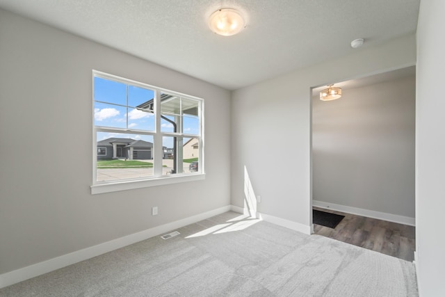 16409 Deerview Dr, Urbandale, IA 50323 - unfurnished room with baseboards, carpet flooring, and visible vents