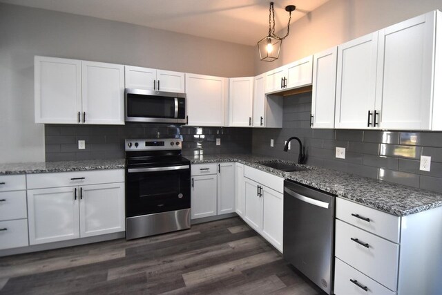 kitchen featuring sink, white cabinets, and stainless steel appliances