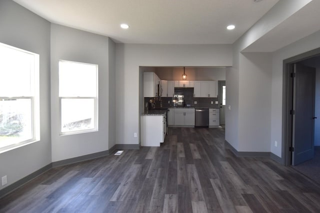 unfurnished living room with dark wood-type flooring