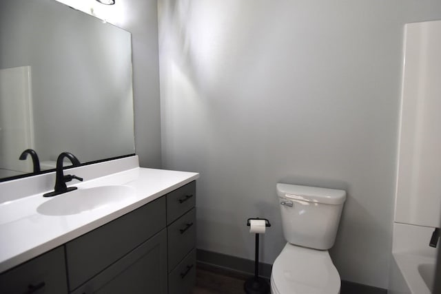 bathroom with vanity and toilet