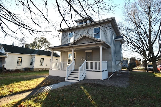 view of front of house featuring a porch and a front lawn