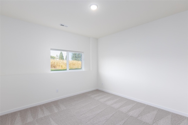 unfurnished room featuring carpet