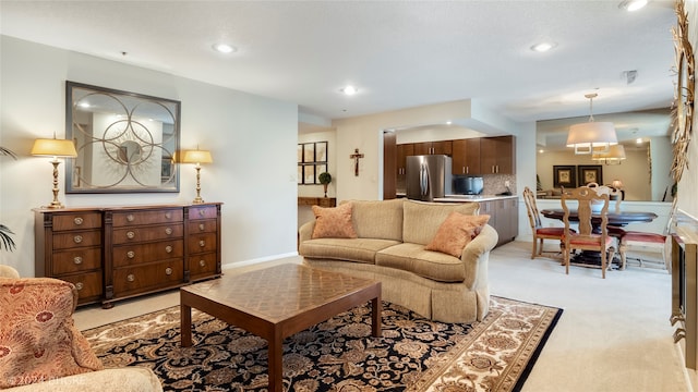 living room featuring light carpet