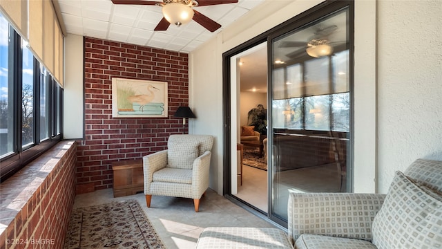 sunroom / solarium with ceiling fan