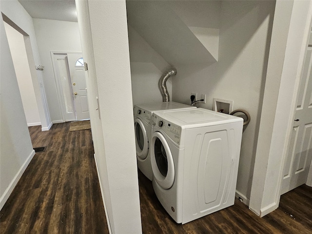 laundry area with independent washer and dryer and dark hardwood / wood-style flooring