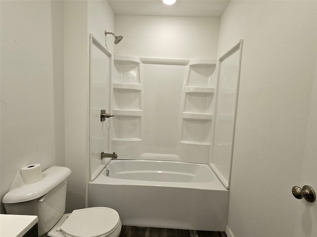 full bathroom with vanity, washtub / shower combination, wood-type flooring, and toilet