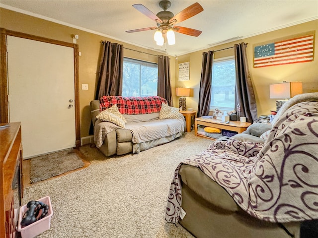 sitting room with carpet flooring, crown molding, plenty of natural light, and ceiling fan