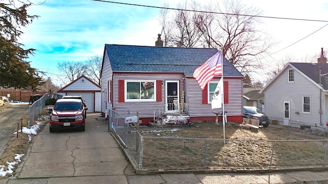 bungalow-style home with an outbuilding and a garage