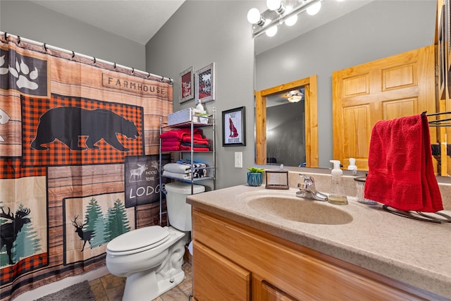 bathroom featuring tile patterned floors, vanity, toilet, and a shower with shower curtain