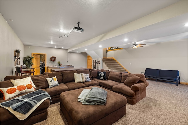 carpeted living room with ceiling fan