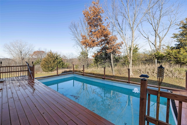 view of swimming pool featuring a wooden deck