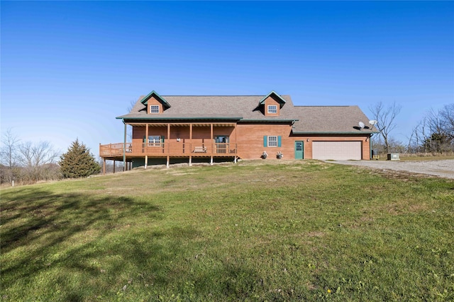 view of front of house with a front yard and a garage