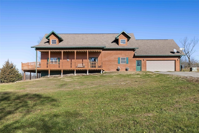 view of front of property with a garage and a front lawn