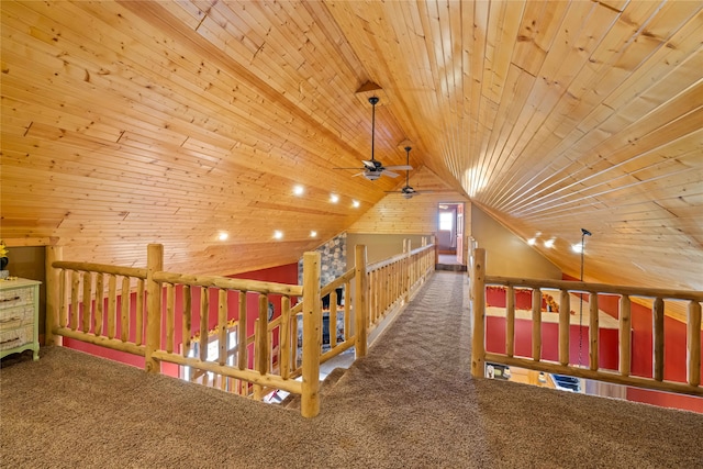 hall with lofted ceiling, wooden ceiling, and carpet floors