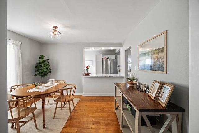 dining room with light hardwood / wood-style floors