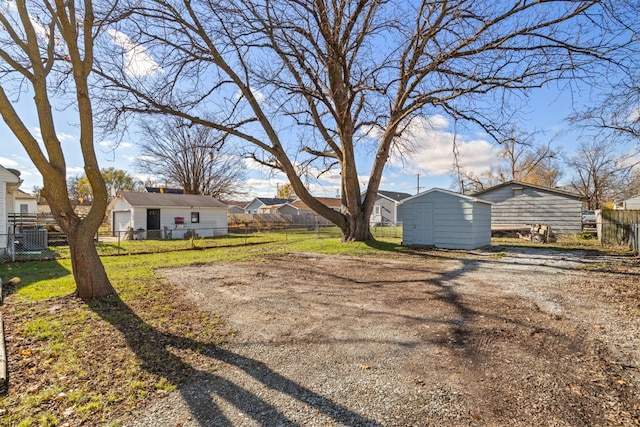 view of yard with a storage shed